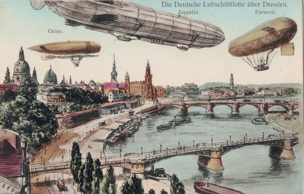Postkarte mit verschiedenen Luftschiffen über Dresden